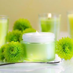 Candles and green flowers at spa