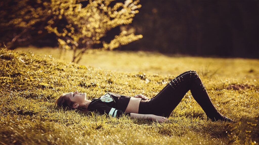 girl lying on grass relaxed